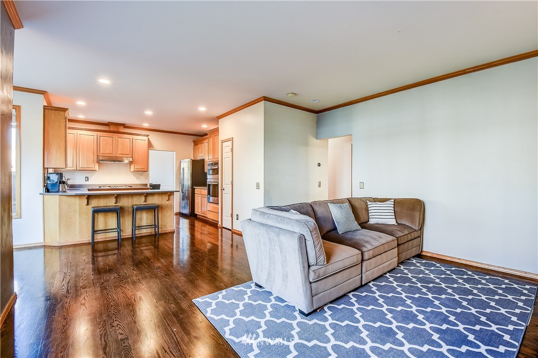 3315 189th Place Southeast Bothell, WA 98012 - Photo 12 of 28 a living room with furniture and a rug