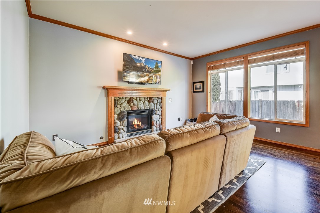 3315 189th Place Southeast Bothell, WA 98012 - Photo 13 of 28 a living room with furniture and a fireplace