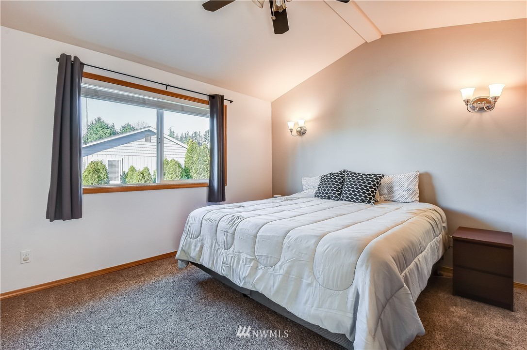 3315 189th Place Southeast Bothell, WA 98012 - Photo 14 of 28 a bedroom with a bed and window