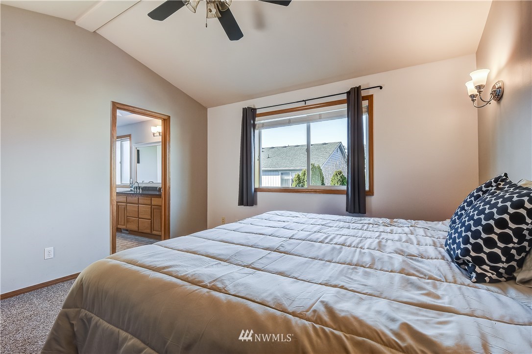 3315 189th Place Southeast Bothell, WA 98012 - Photo 15 of 28 a bedroom with a bed and a window