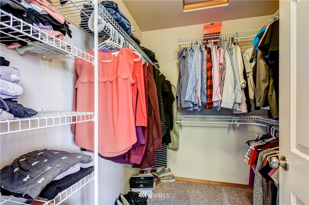 3315 189th Place Southeast Bothell, WA 98012 - Photo 16 of 28 a view of walk in closet with clothes and shoes