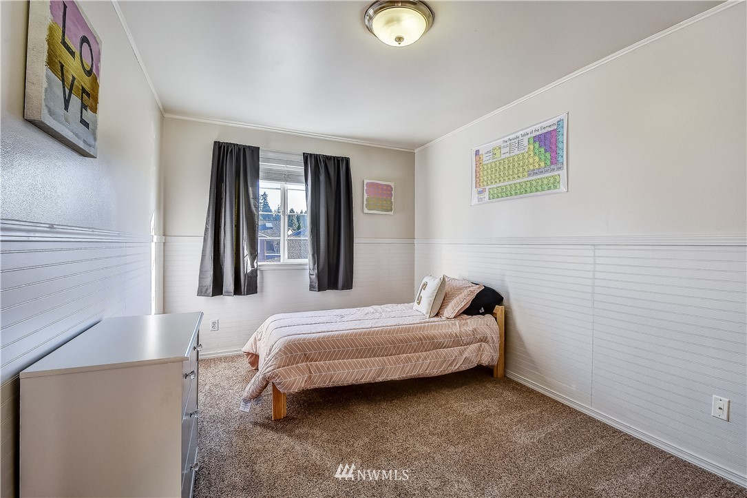 3315 189th Place Southeast Bothell, WA 98012 - Photo 19 of 28 a bedroom with a bed and a window