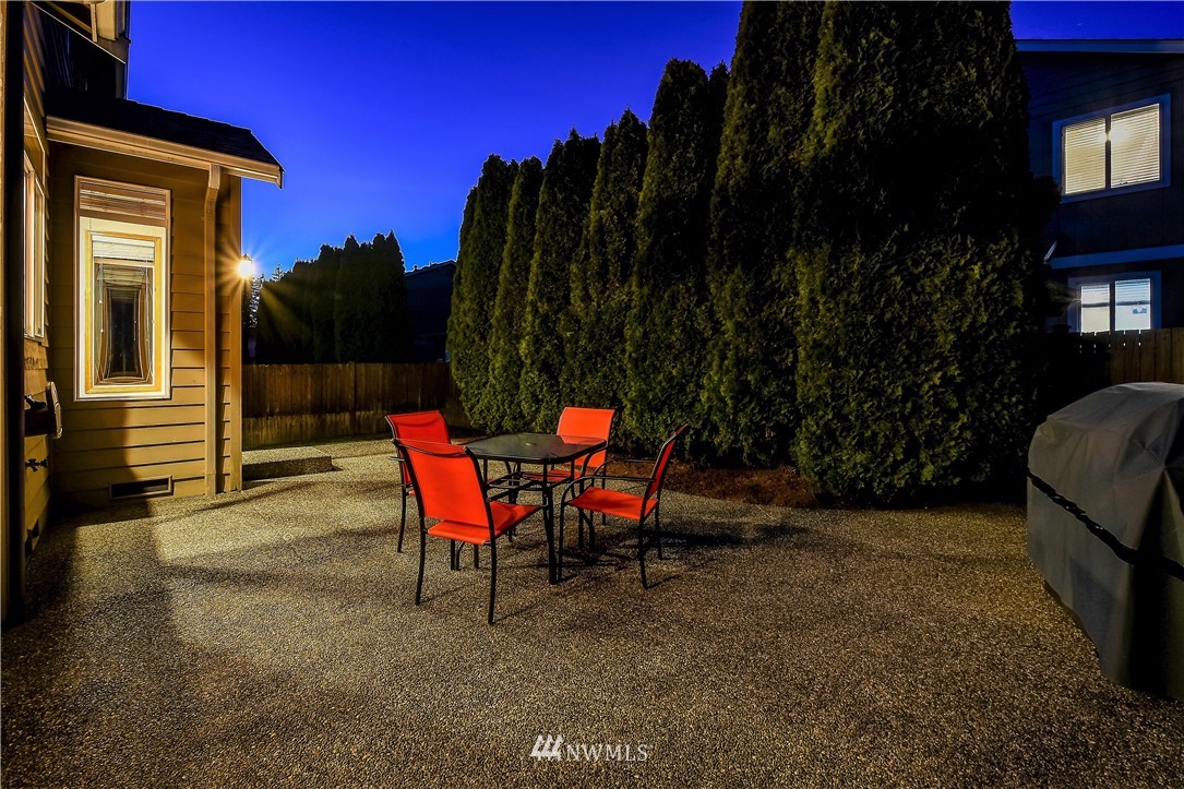 3315 189th Place Southeast Bothell, WA 98012 - Photo 28 of 28 a backyard of a house with table and chairs
