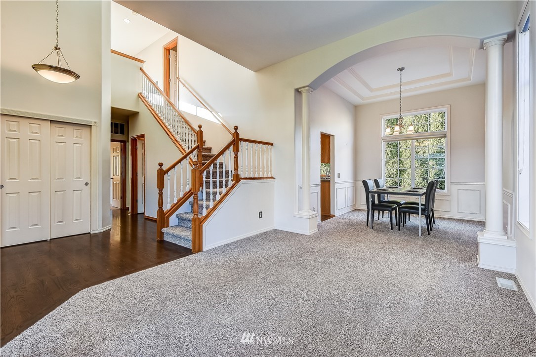 3315 189th Place Southeast Bothell, WA 98012 - Photo 4 of 28 a view of an chairs and table in a room with a window