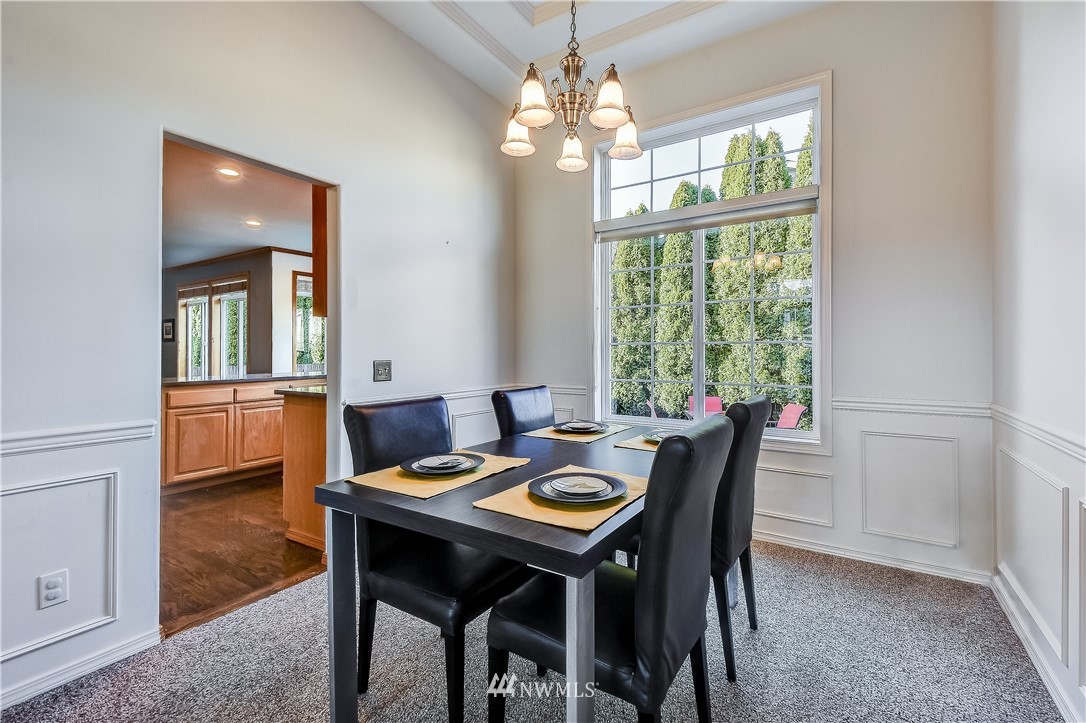 3315 189th Place Southeast Bothell, WA 98012 - Photo 6 of 28 a view of a dining room with furniture window and wooden floor