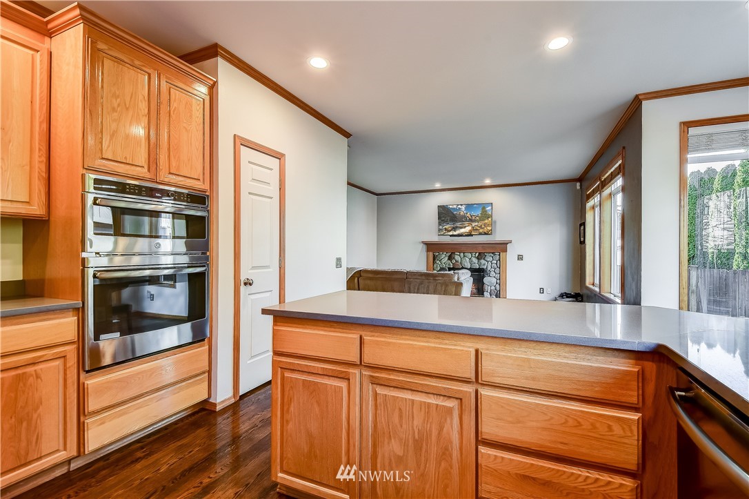 3315 189th Place Southeast Bothell, WA 98012 - Photo 9 of 28 a kitchen with stainless steel appliances granite countertop a refrigerator and a sink