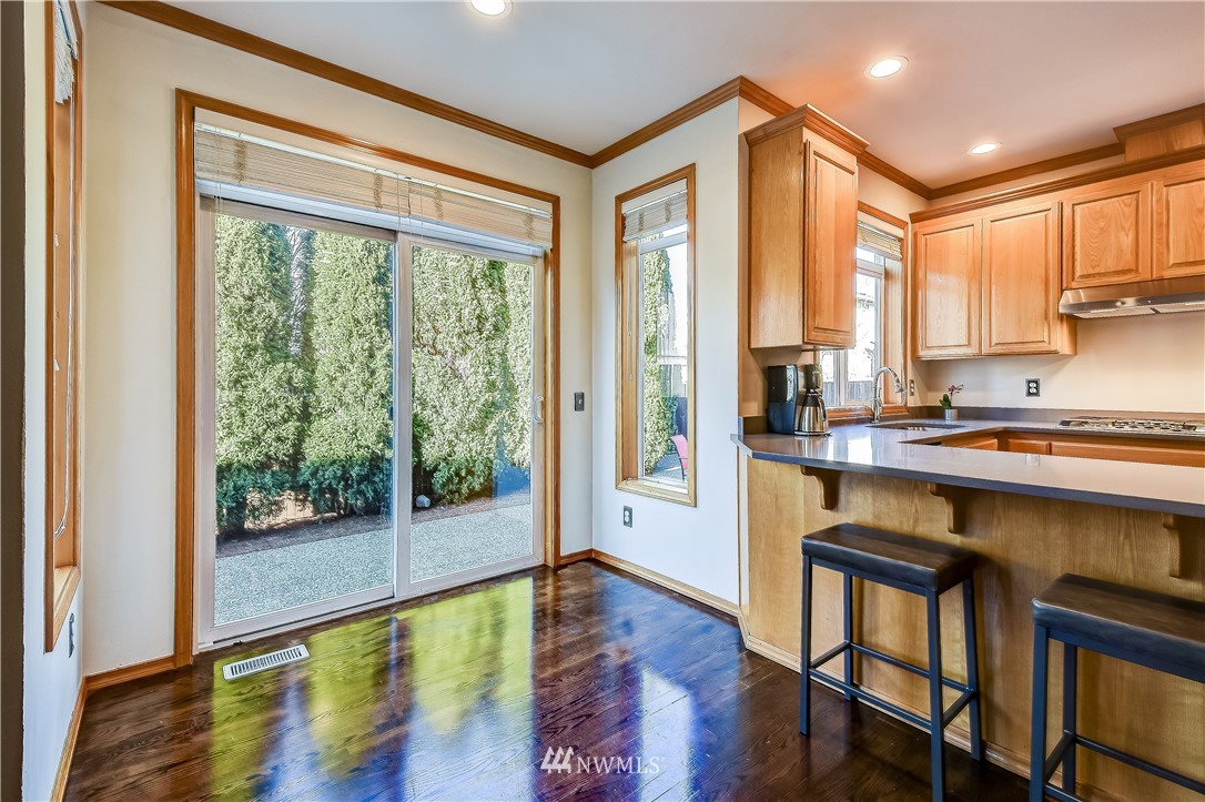 3315 189th Place Southeast Bothell, WA 98012 - Photo 10 of 28 a very nice looking kitchen with a large window and wooden floor
