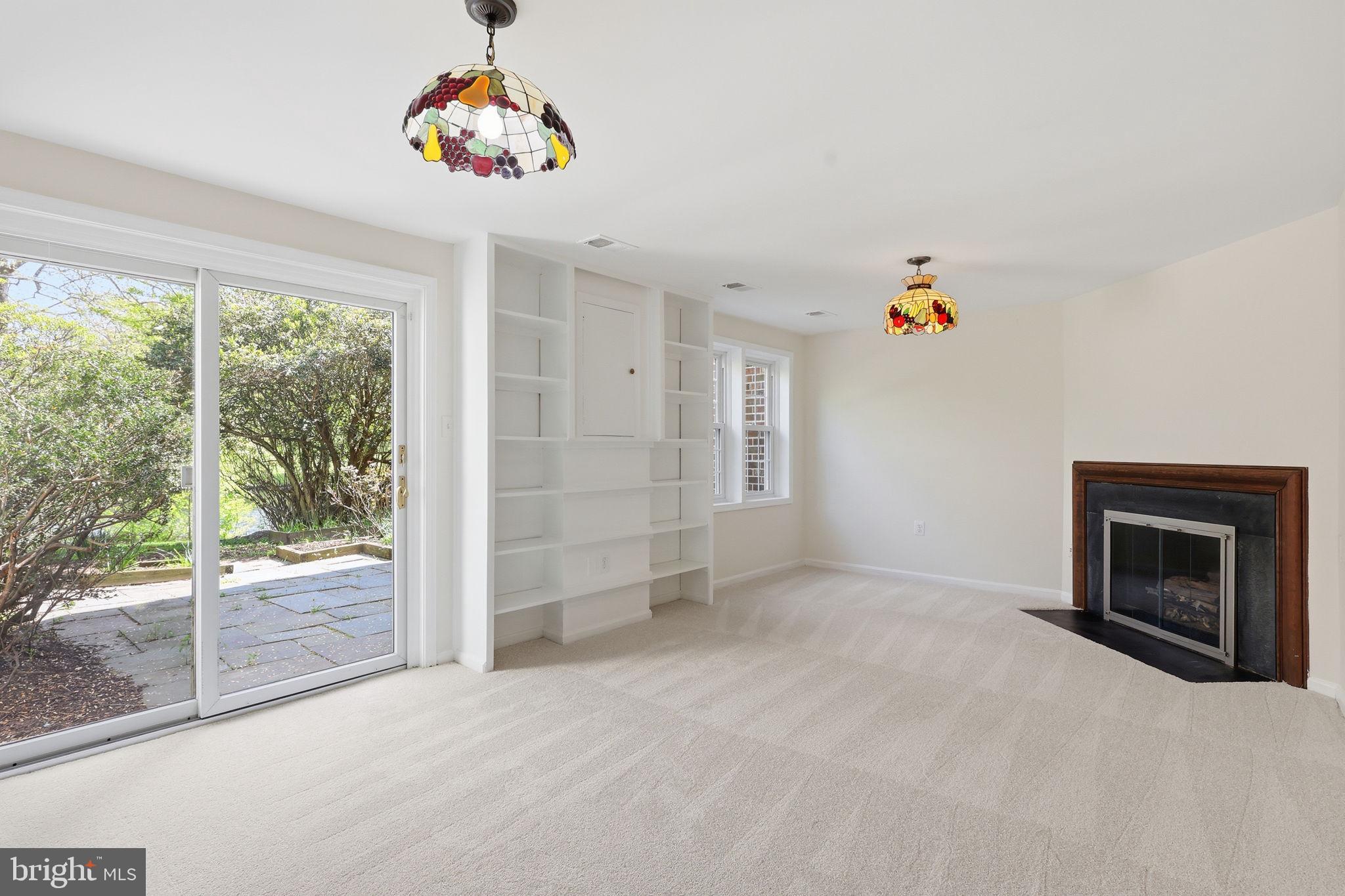 2151 Greenkeepers Court Reston, VA 20191 - Photo 26 of 44 Very large rec room with built-ins, leads to patio