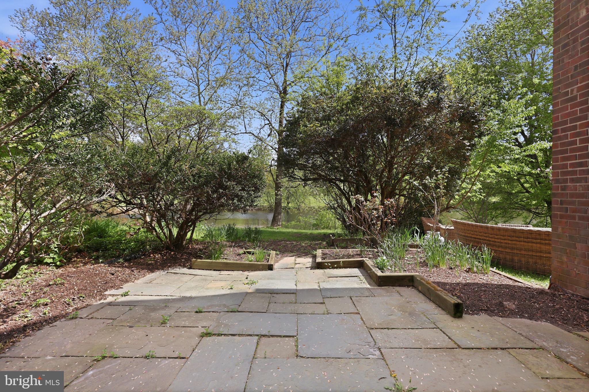 2151 Greenkeepers Court Reston, VA 20191 - Photo 33 of 44 Private blue stone patio overlooking the pond
