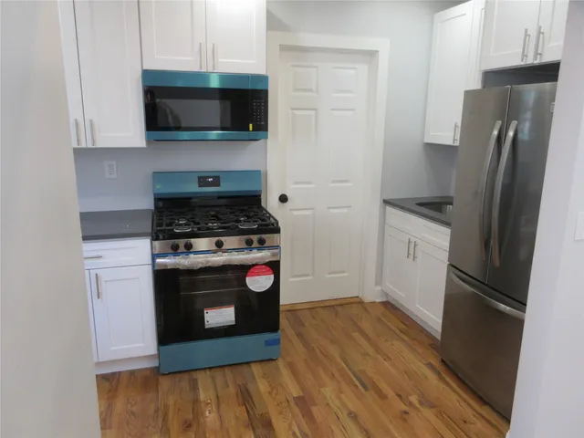 a kitchen with a stove and a refrigerator