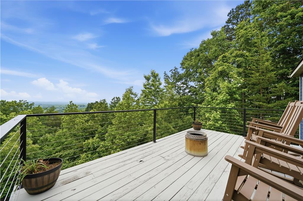 97 Eagle Ridge Trail Cleveland, GA 30528 - Photo 10 of 58 a view of a balcony with mountain view and wooden floor