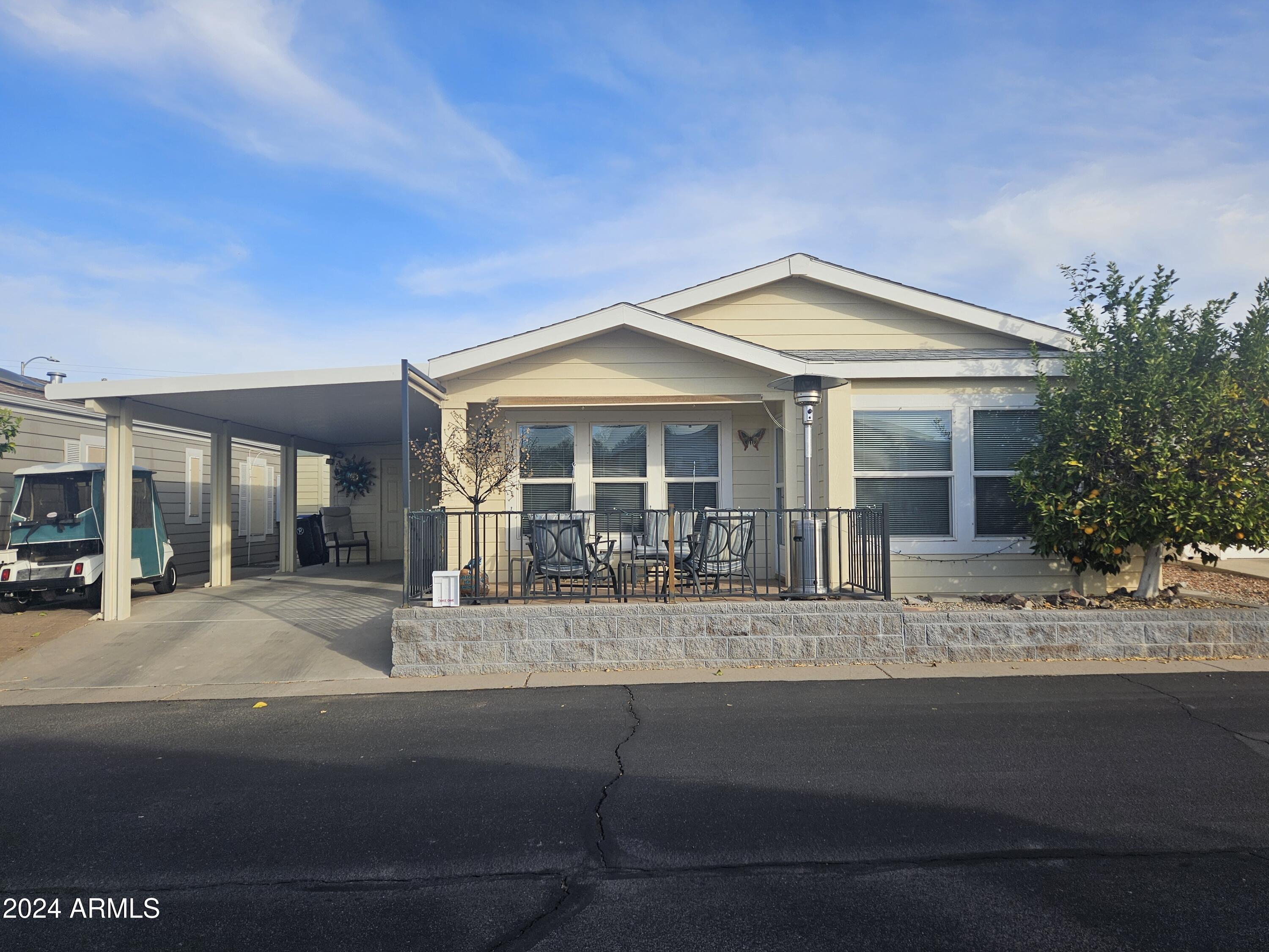 650 North Hawes Road, Unit 4412 Mesa, AZ 85207 - Photo 1 of 48 a front view of a house with a yard