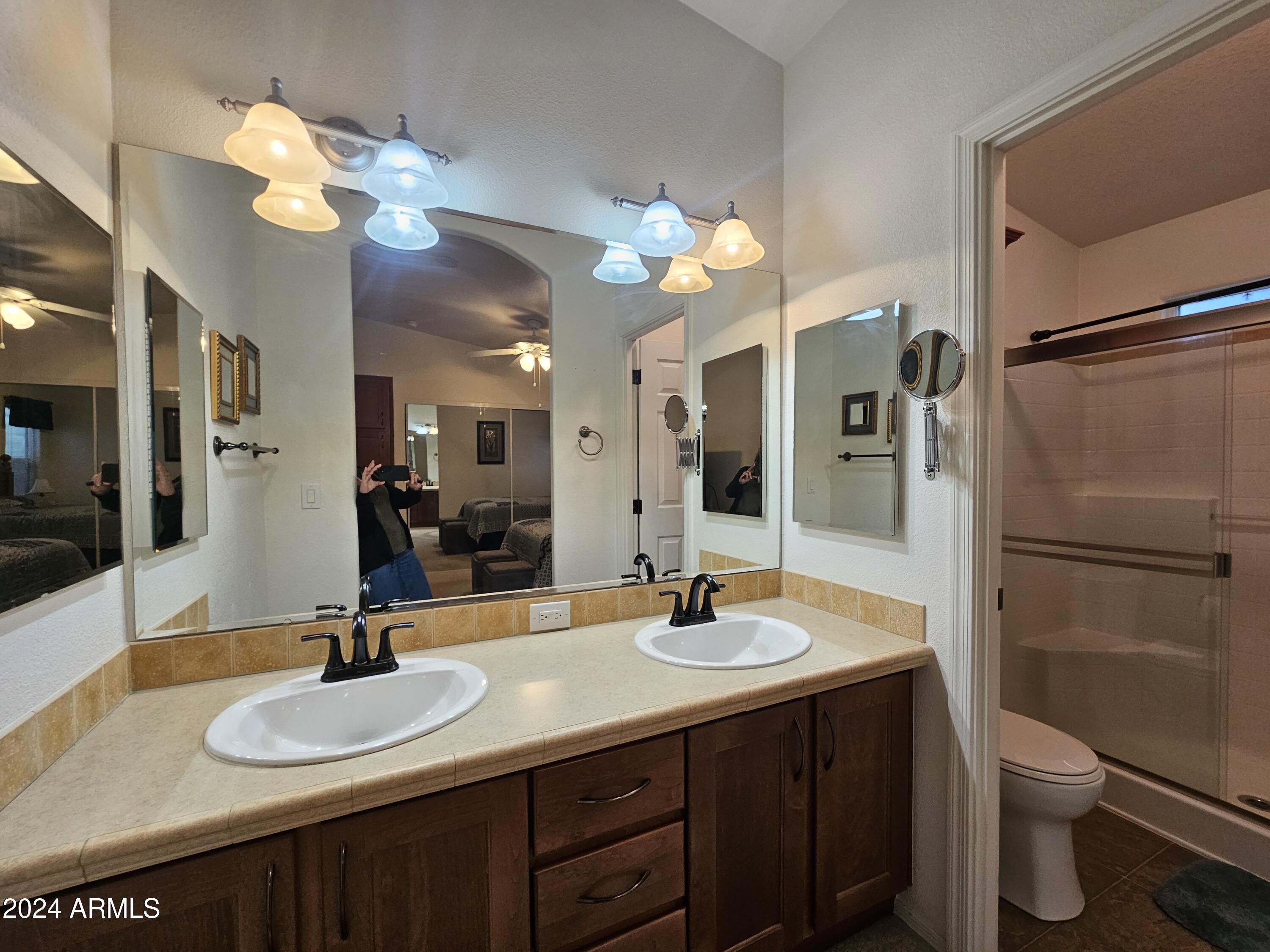 650 North Hawes Road, Unit 4412 Mesa, AZ 85207 - Photo 20 of 48 a bathroom with a sink a toilet and a mirror