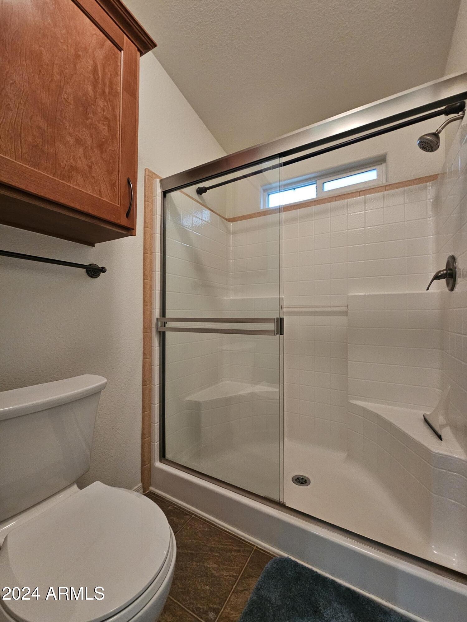 650 North Hawes Road, Unit 4412 Mesa, AZ 85207 - Photo 21 of 48 a bathroom with a toilet and a shower