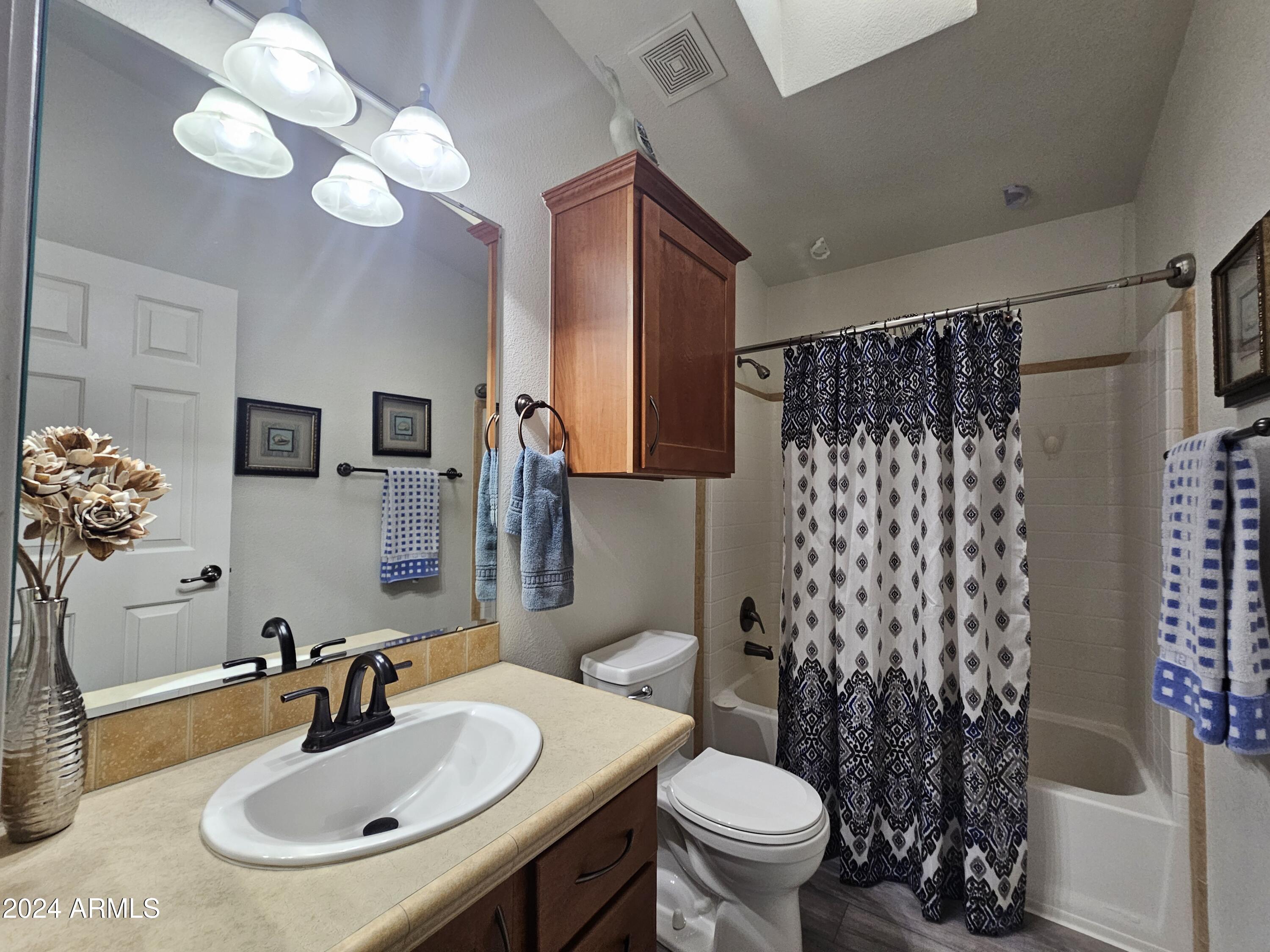 650 North Hawes Road, Unit 4412 Mesa, AZ 85207 - Photo 23 of 48 a bathroom with a sink toilet and shower