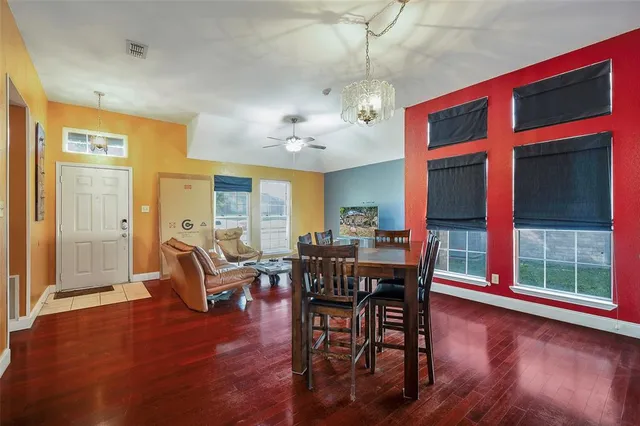 a view of a dining room with furniture window and wooden floor