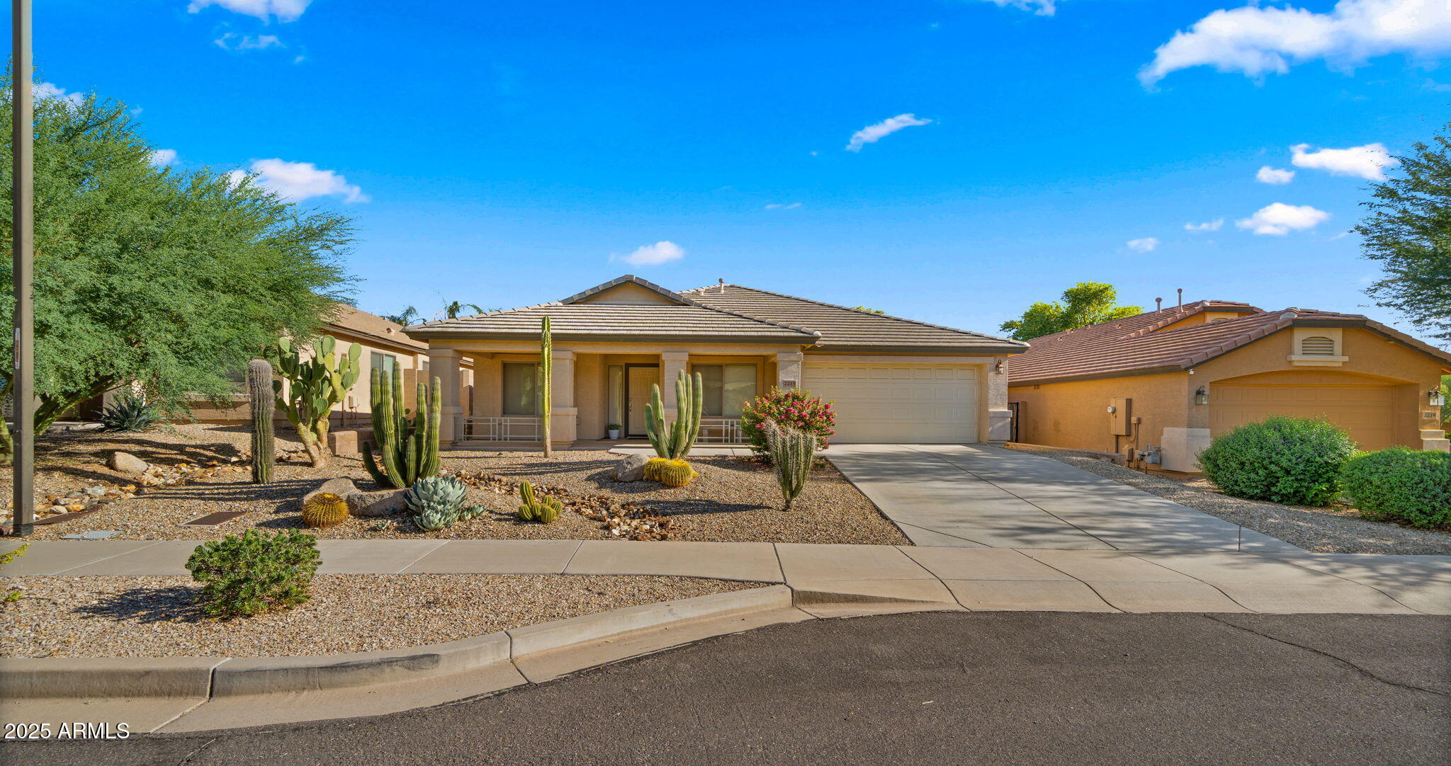 a view of a house with entertaining space and a car park in front of it