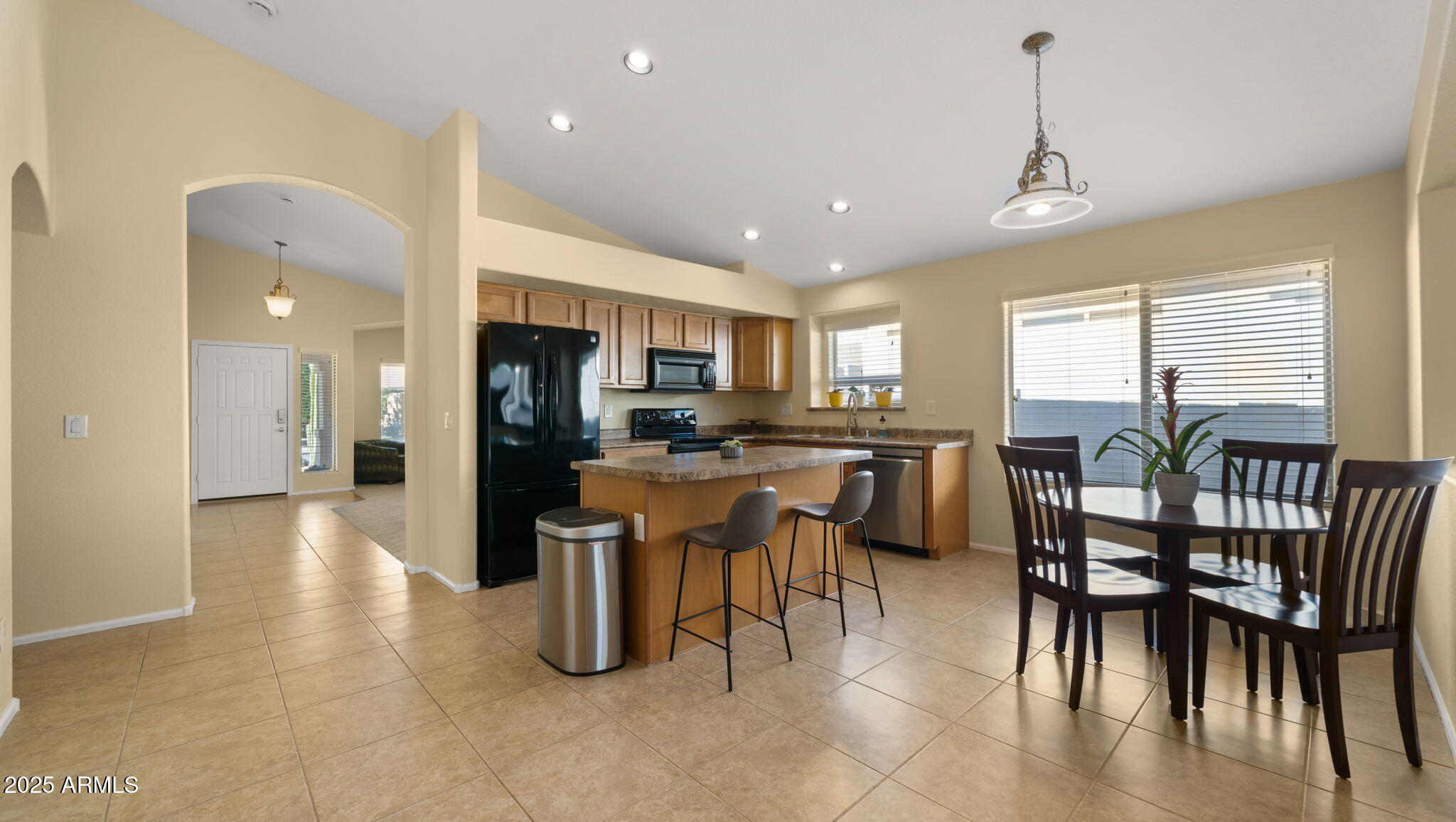2215 West Peak View Road Phoenix, AZ 85085 - Photo 13 of 51 a view of a dining area with furniture window and outside view