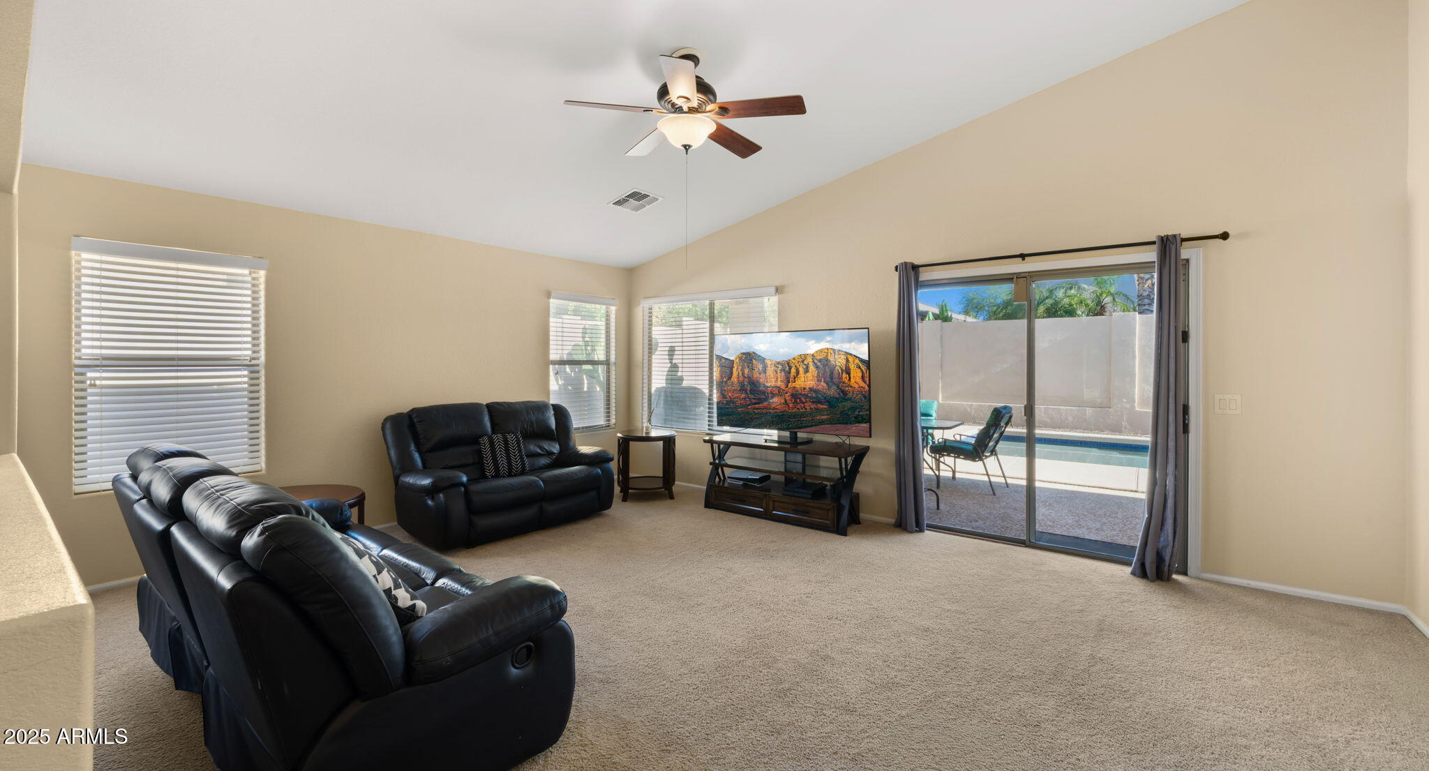 2215 West Peak View Road Phoenix, AZ 85085 - Photo 20 of 51 a living room with furniture ceiling fan and a window