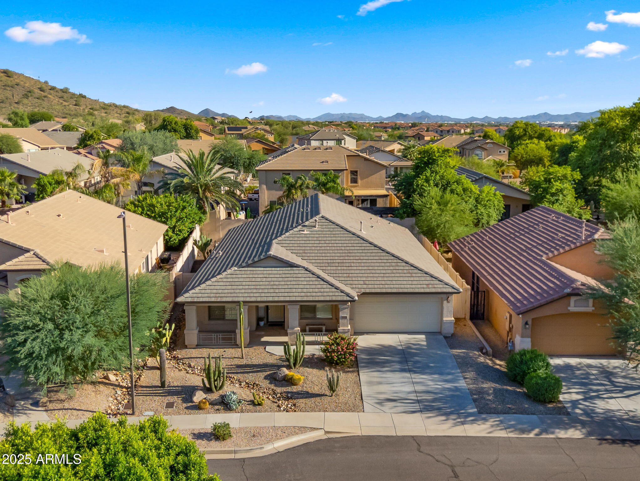 2215 West Peak View Road Phoenix, AZ 85085 - Photo 2 of 51 an aerial view of a house with garden space and street view