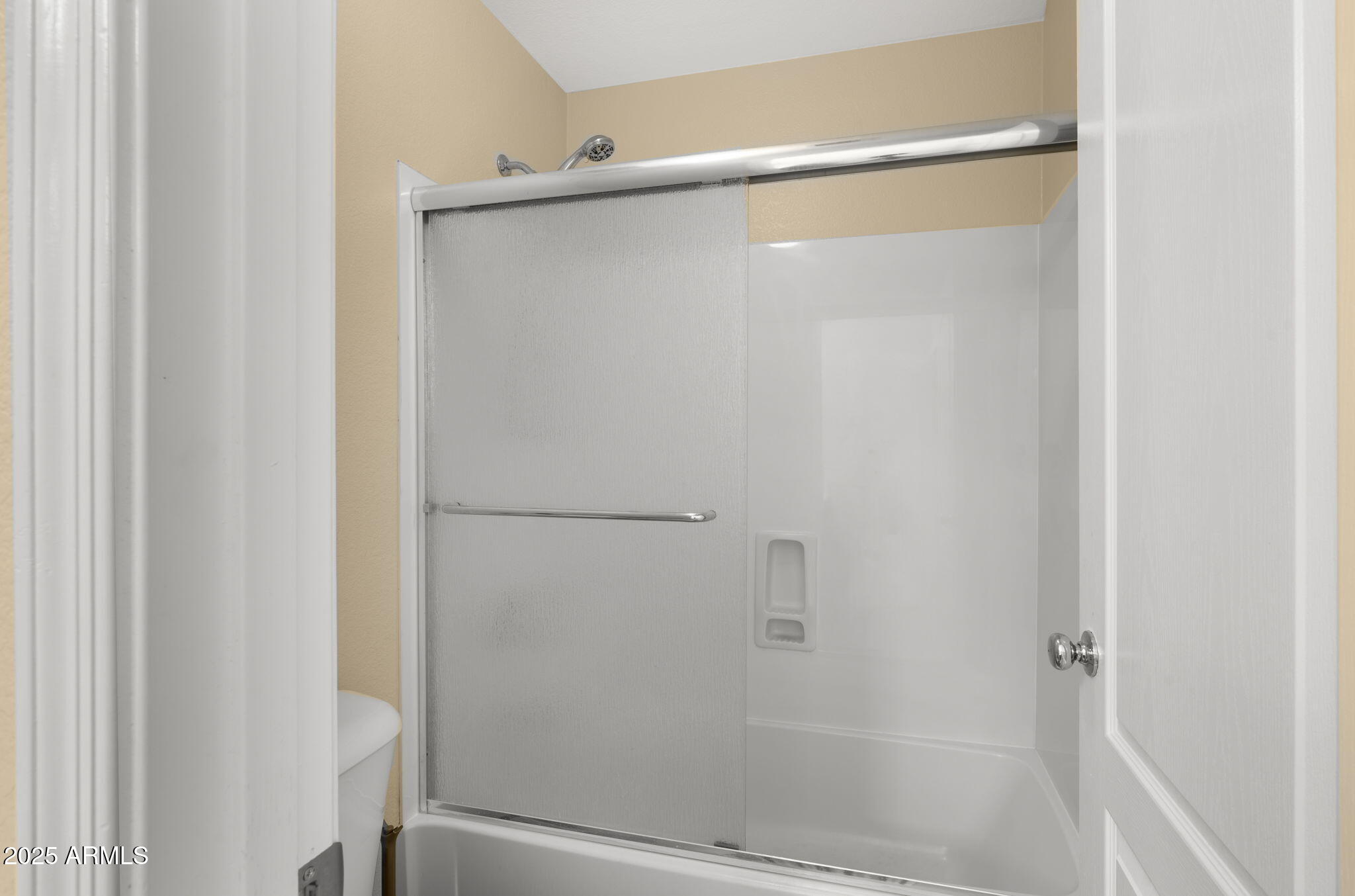 2215 West Peak View Road Phoenix, AZ 85085 - Photo 24 of 51 a bathroom with a glass shower door