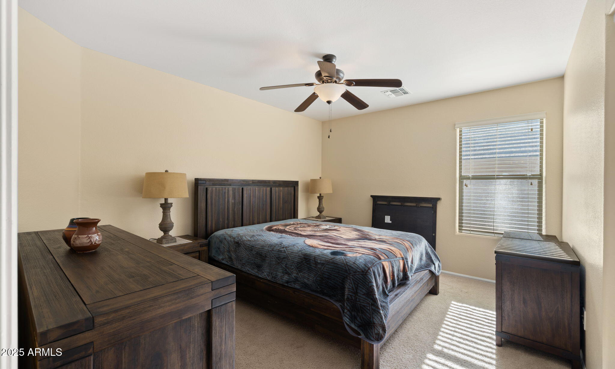 2215 West Peak View Road Phoenix, AZ 85085 - Photo 27 of 51 a bedroom with a bed and wooden floor