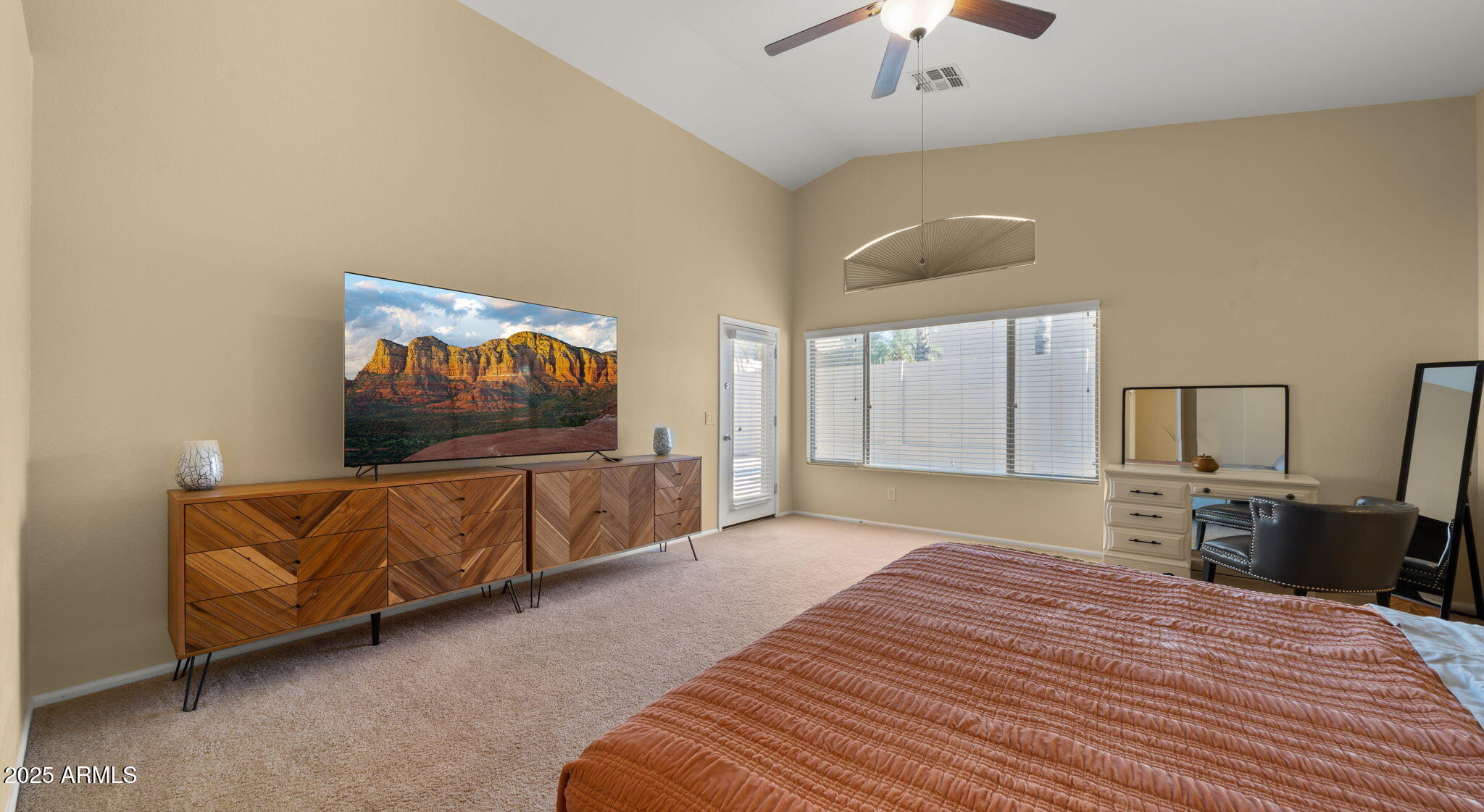 2215 West Peak View Road Phoenix, AZ 85085 - Photo 30 of 51 a bedroom with furniture and a flat screen tv