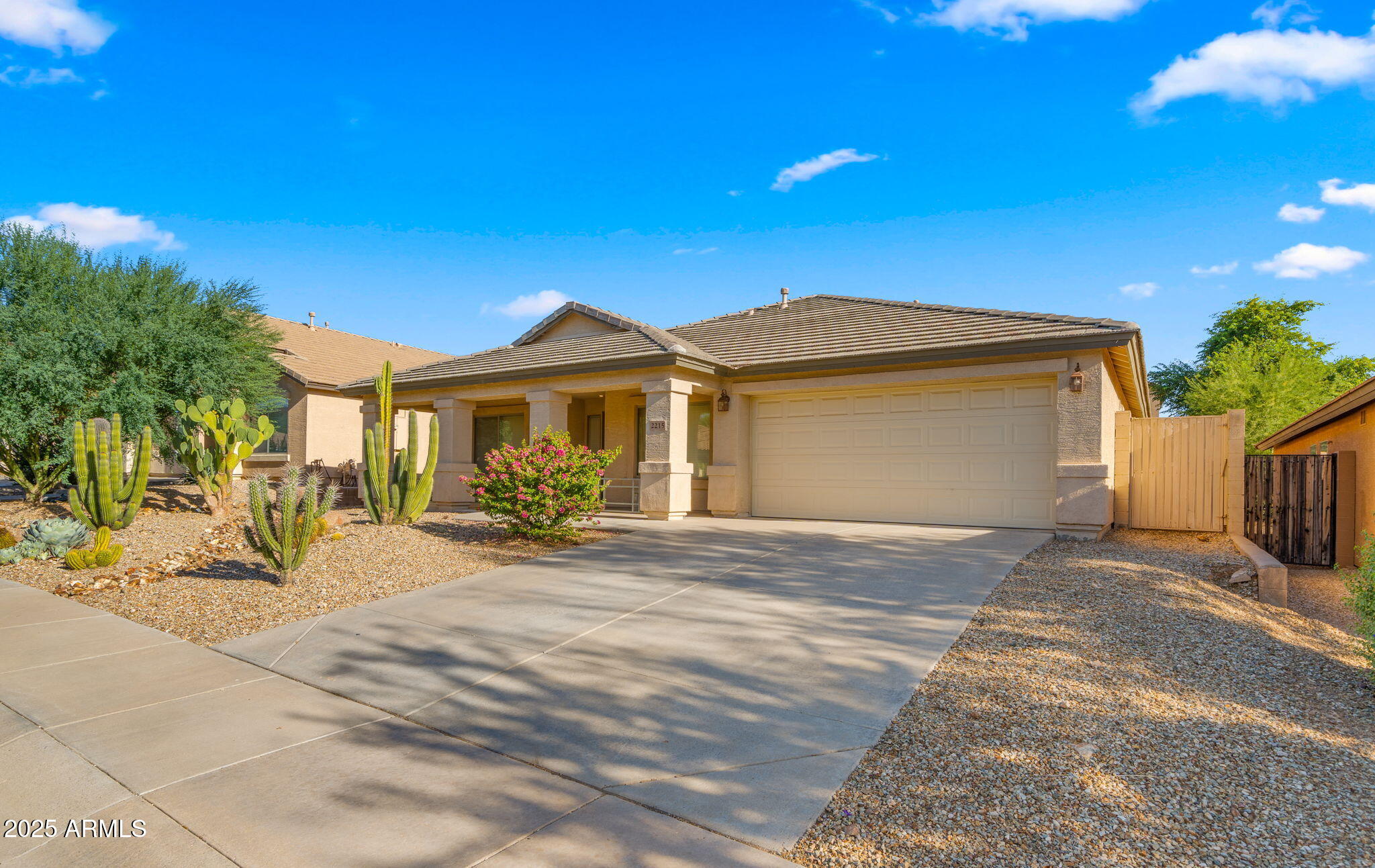 2215 West Peak View Road Phoenix, AZ 85085 - Photo 3 of 51 a front view of a house with a yard