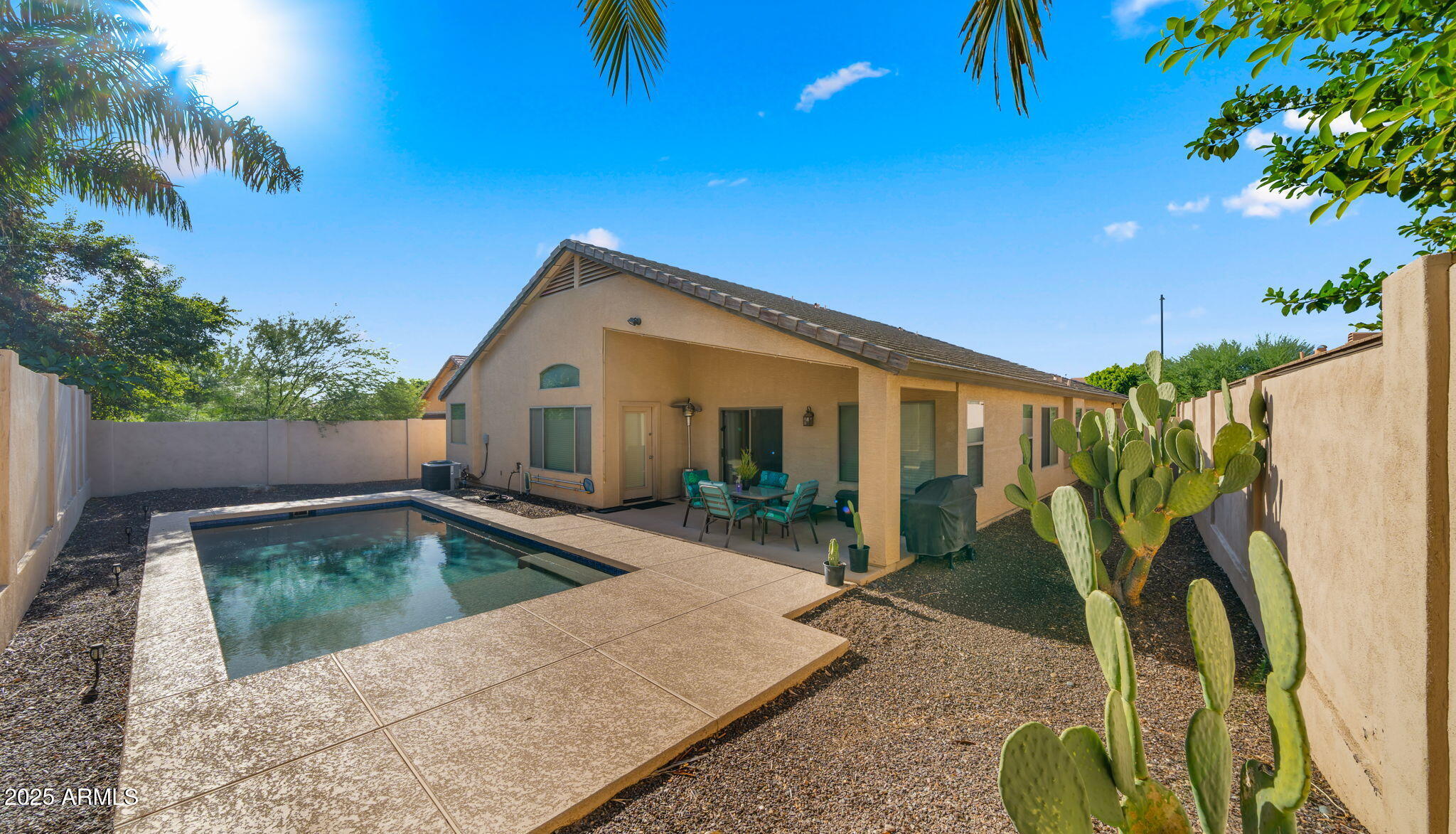 2215 West Peak View Road Phoenix, AZ 85085 - Photo 37 of 51 a view of a house with backyard and sitting area