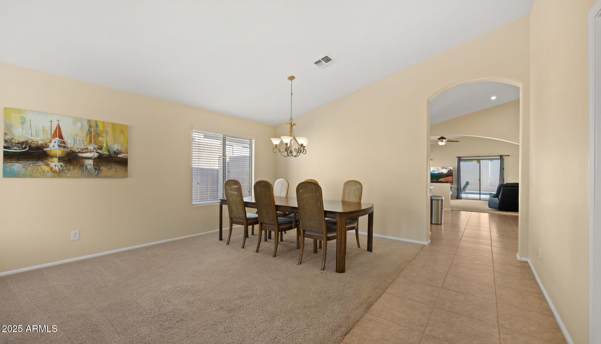 2215 West Peak View Road Phoenix, AZ 85085 - Photo 6 of 51 a view of a dining room with furniture and chandelier