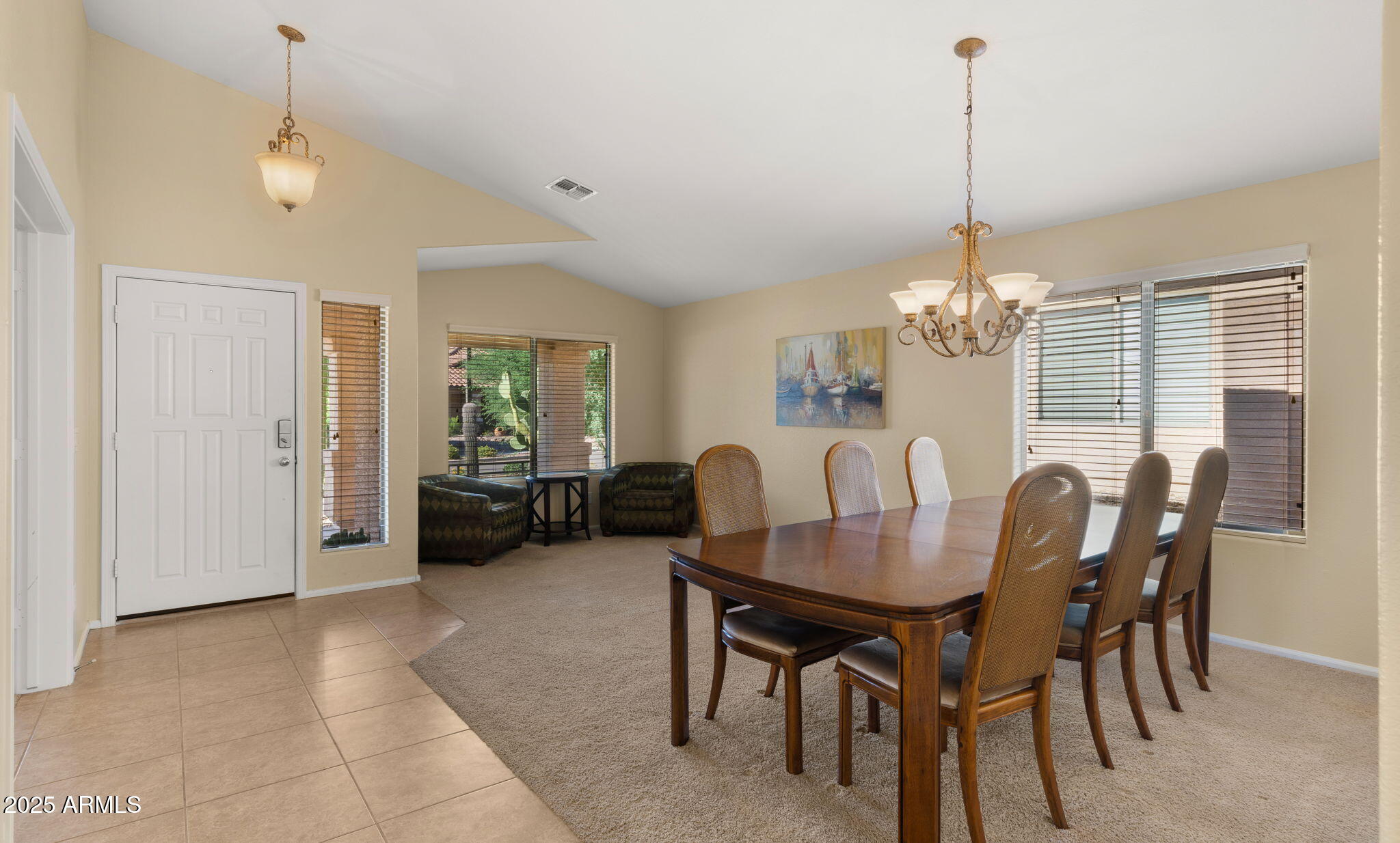 2215 West Peak View Road Phoenix, AZ 85085 - Photo 7 of 51 a view of a dining room with furniture window and chandelier
