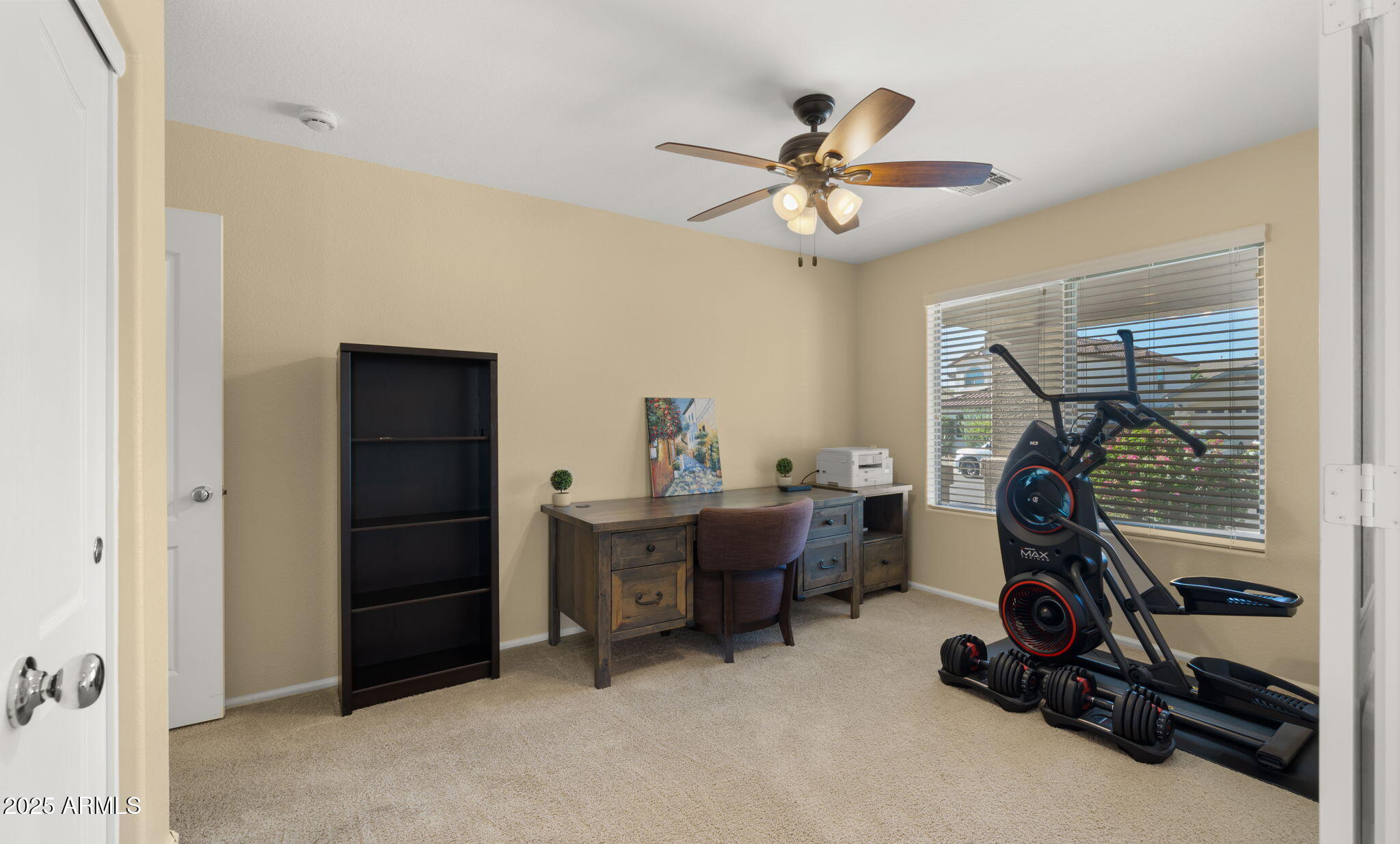 2215 West Peak View Road Phoenix, AZ 85085 - Photo 8 of 51 a view of a workspace with furniture and a window