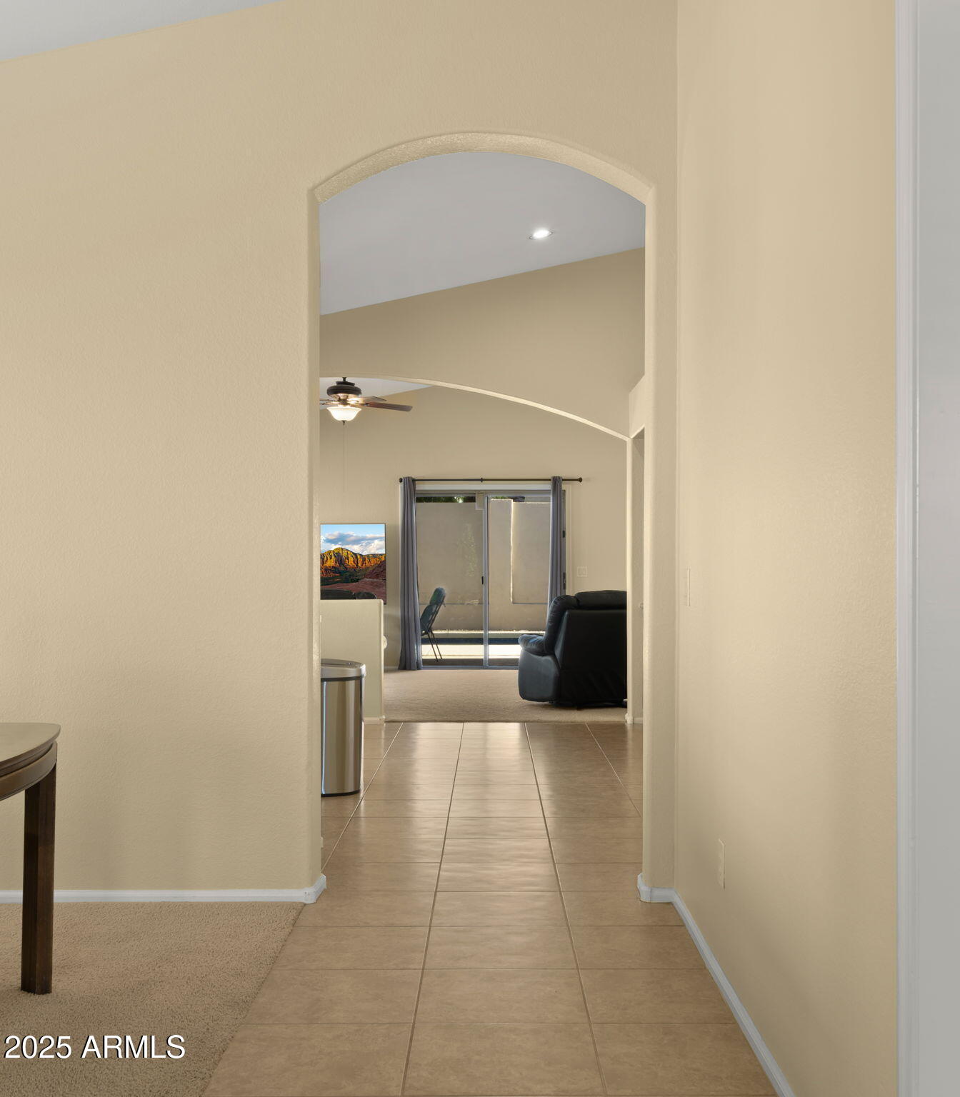 2215 West Peak View Road Phoenix, AZ 85085 - Photo 10 of 51 a view of a hallway with a couch and chandelier