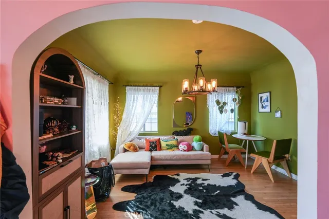 a kitchen with stainless steel appliances granite countertop a stove a sink dishwasher and cabinets with wooden floor