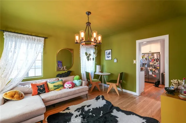 a kitchen with stainless steel appliances granite countertop a stove a sink and white cabinets