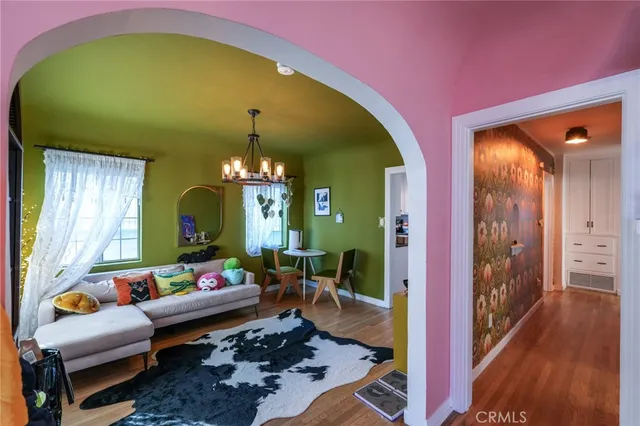 a view of a room with wooden floor
