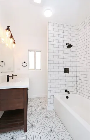 a view of a house with a yard and sitting area