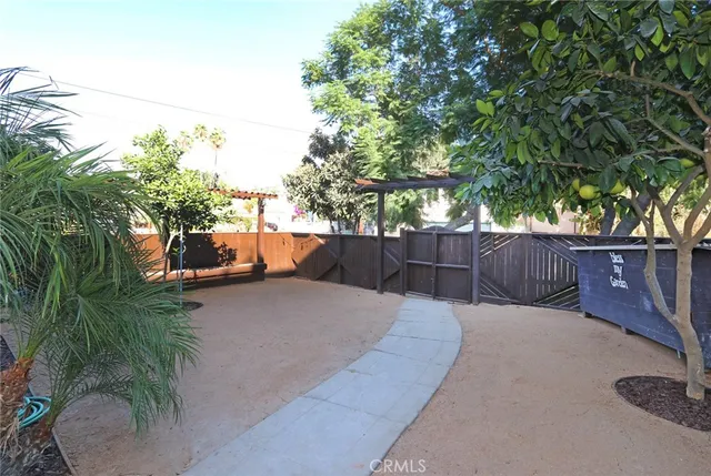 a kitchen with stainless steel appliances granite countertop a sink and a stove