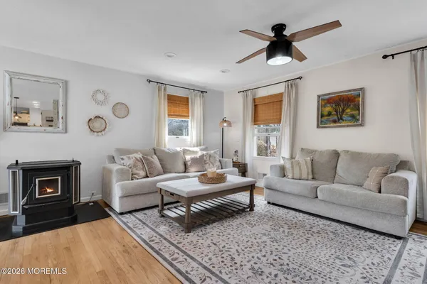 a living room with furniture and stairs