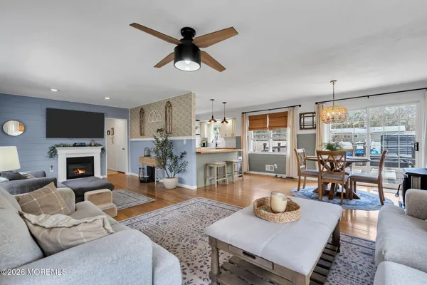 a living room with furniture a flat screen tv and a rug