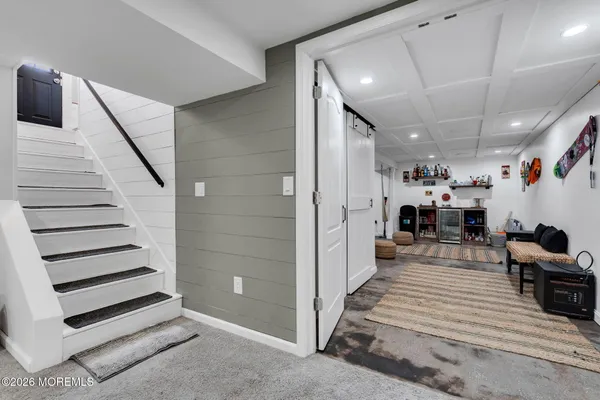 a view of a house with backyard porch and sitting area