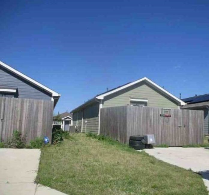 471 Reverie Way Ferris, TX 75125 - Photo 3 of 5 a front view of a house with garden