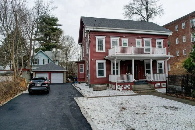 a front view of a building with sitting area