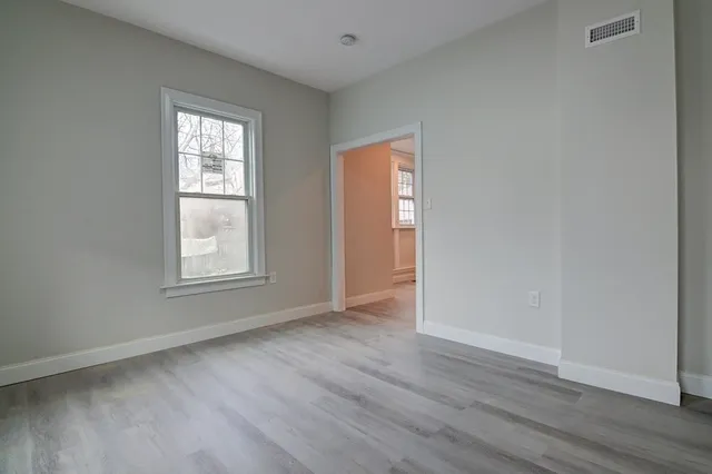 wooden floor and windows in an empty room