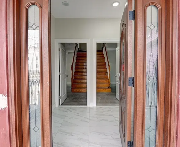 a view of a room with lots of windows