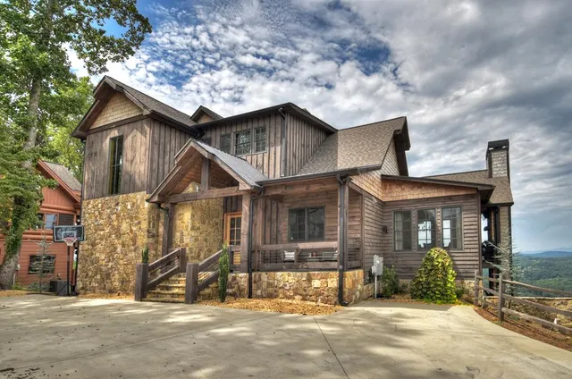 a view of a swimming pool with an outdoor seating