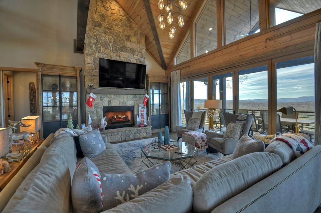 472 Overlook Drive Blue Ridge, GA 30513 - Photo 11 of 70 a living room with furniture a flat screen tv and a fireplace