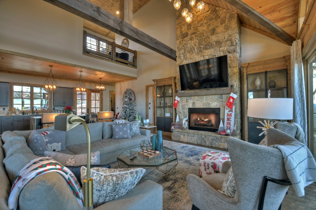 472 Overlook Drive Blue Ridge, GA 30513 - Photo 14 of 70 a living room with furniture a flat screen tv and a fireplace