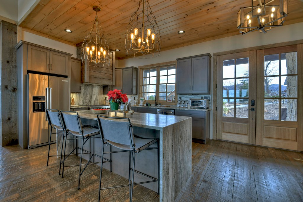 472 Overlook Drive Blue Ridge, GA 30513 - Photo 16 of 70 a view of a dining room with furniture a chandelier and wooden floor