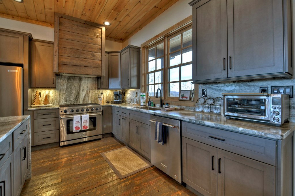 472 Overlook Drive Blue Ridge, GA 30513 - Photo 17 of 70 a kitchen with stainless steel appliances granite countertop a stove and cabinets